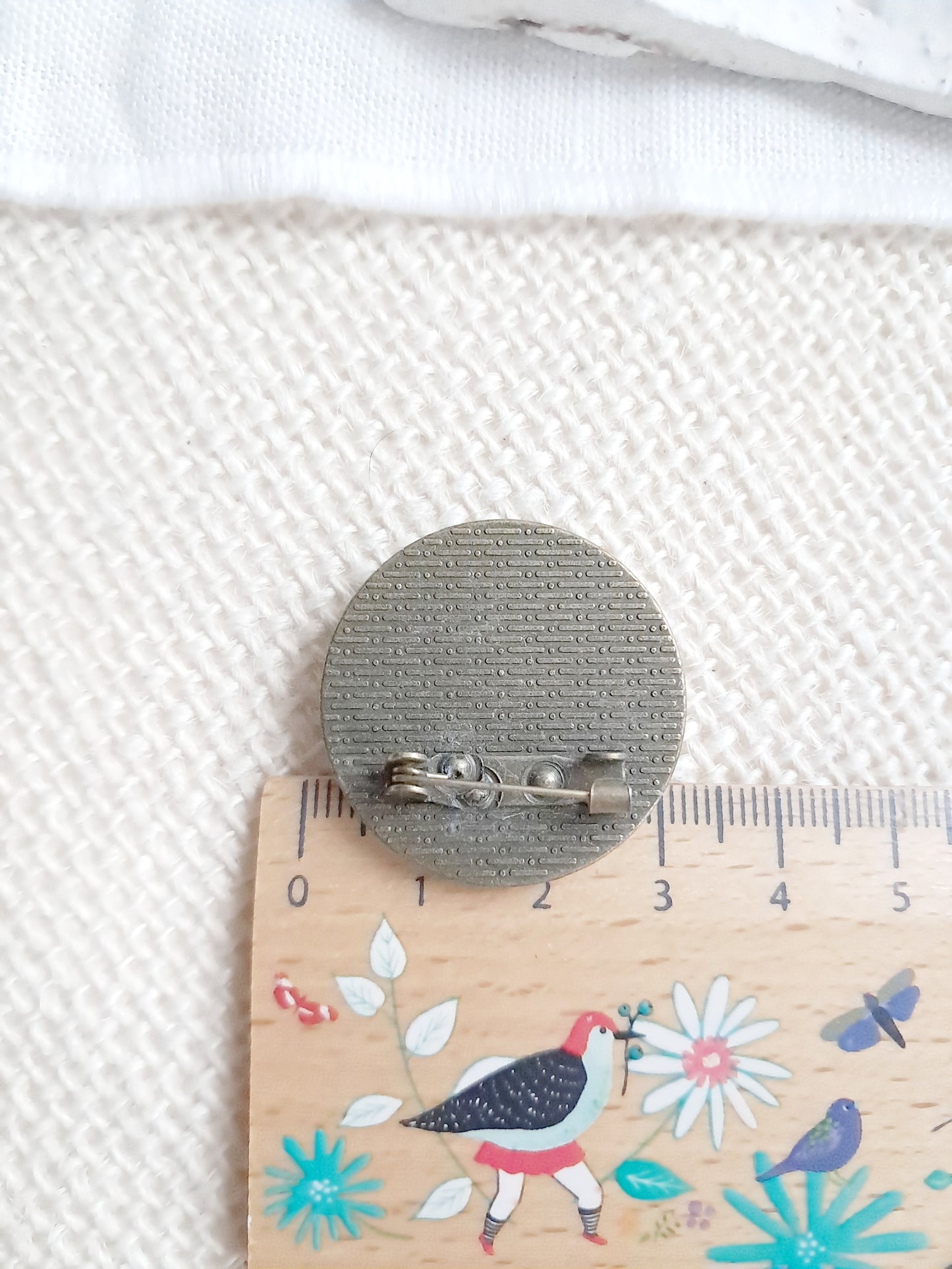 Broche cabochon oiseau