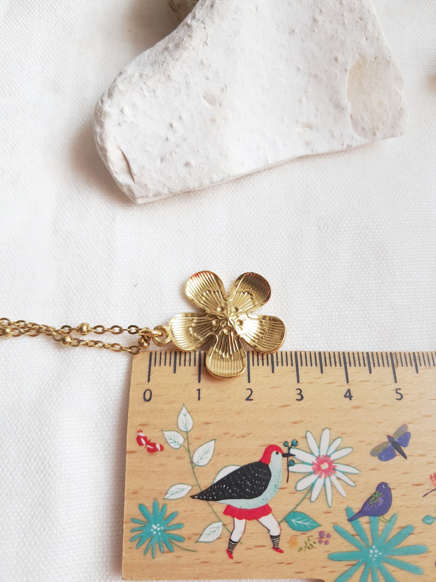 Collier fleur en acier inoxydable doré