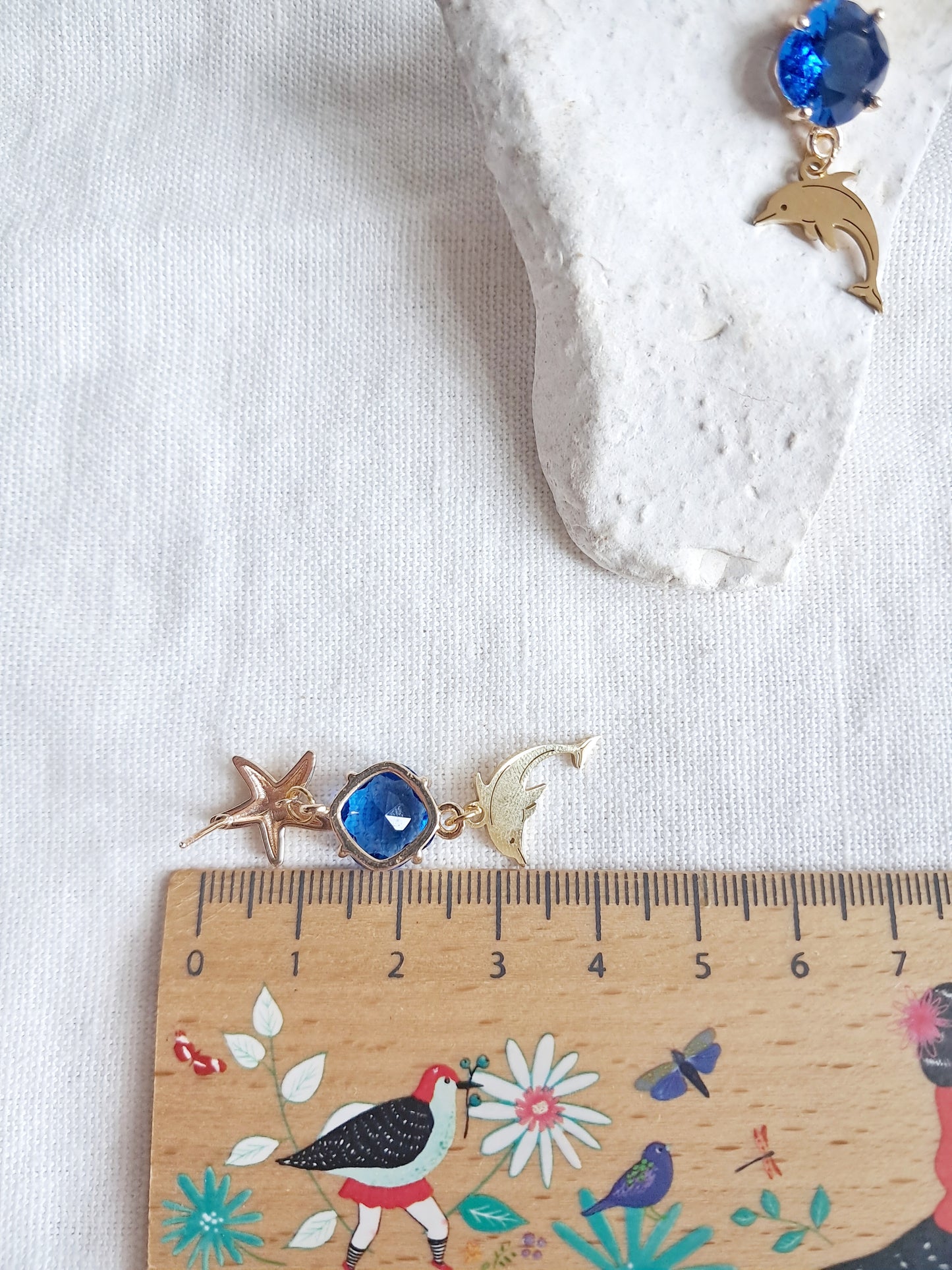 Boucles d'oreilles étoiles de mer, dauphins et gemmes bleues