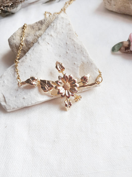 Collier branche de fleurs en acier inoxydable doré