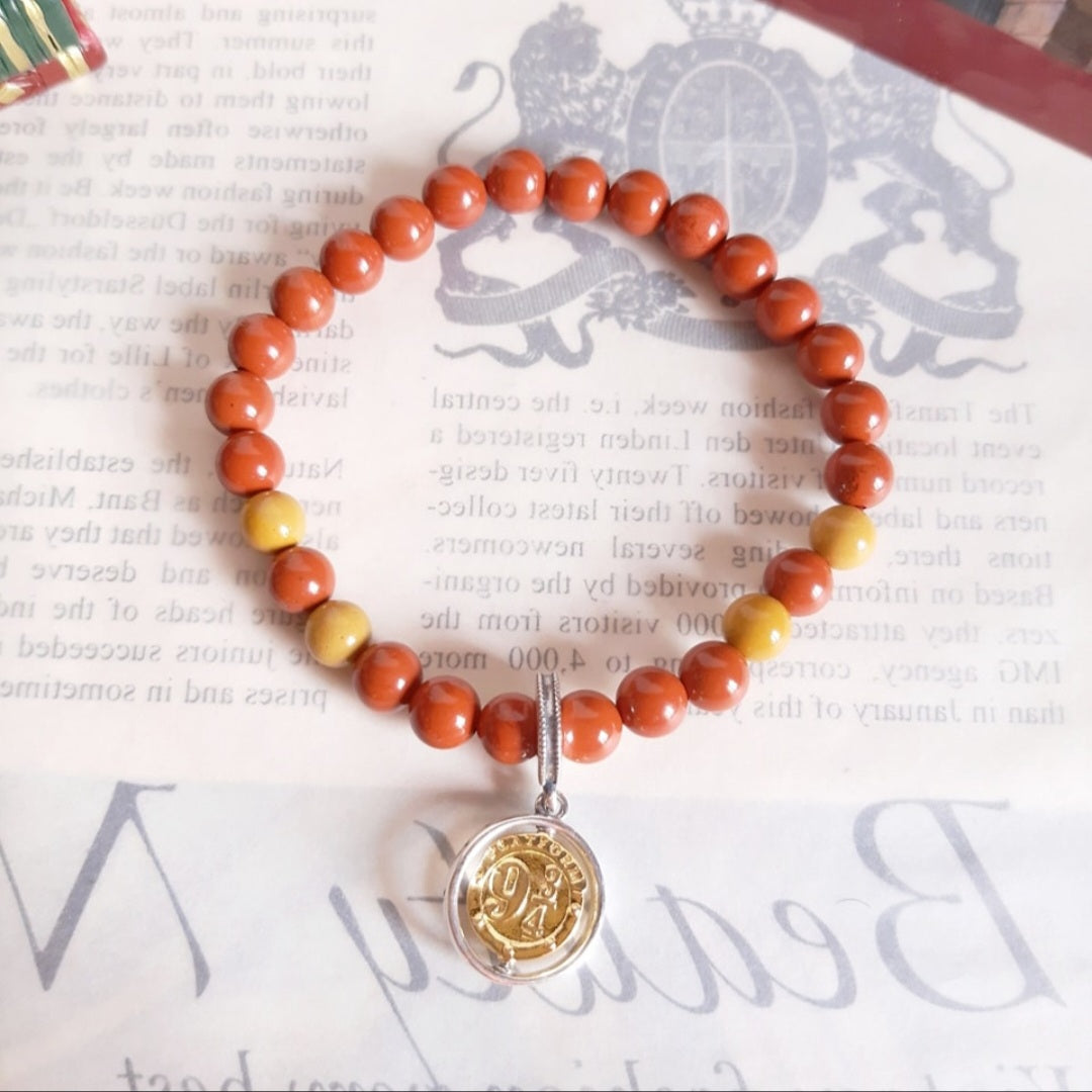 9 ¾ bracelet with its charm