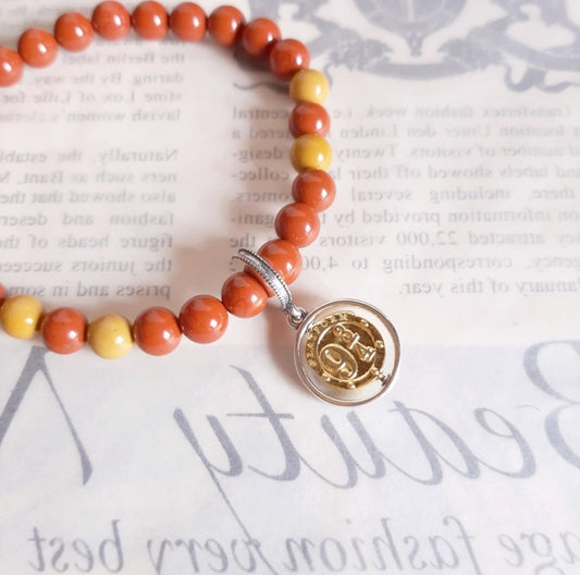 9 ¾ bracelet with its charm