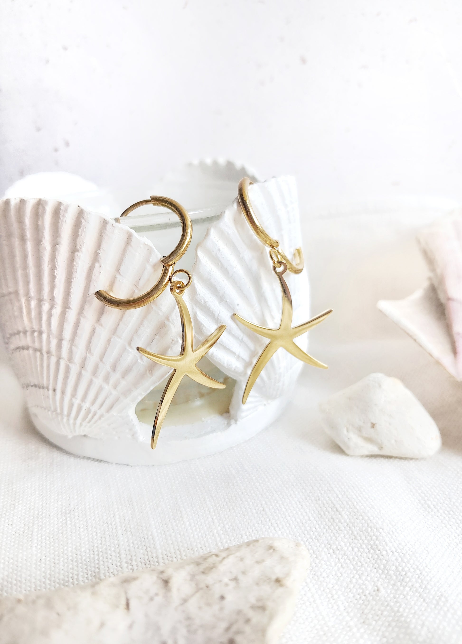 Boucles d'oreilles créoles étoiles de mer en acier inoxydable doré