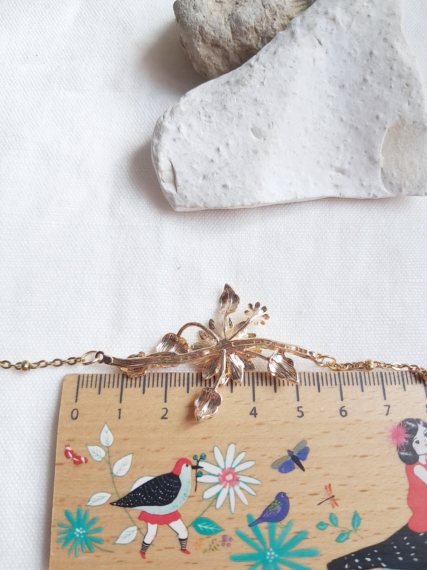 Collier branche de fleurs en acier inoxydable doré