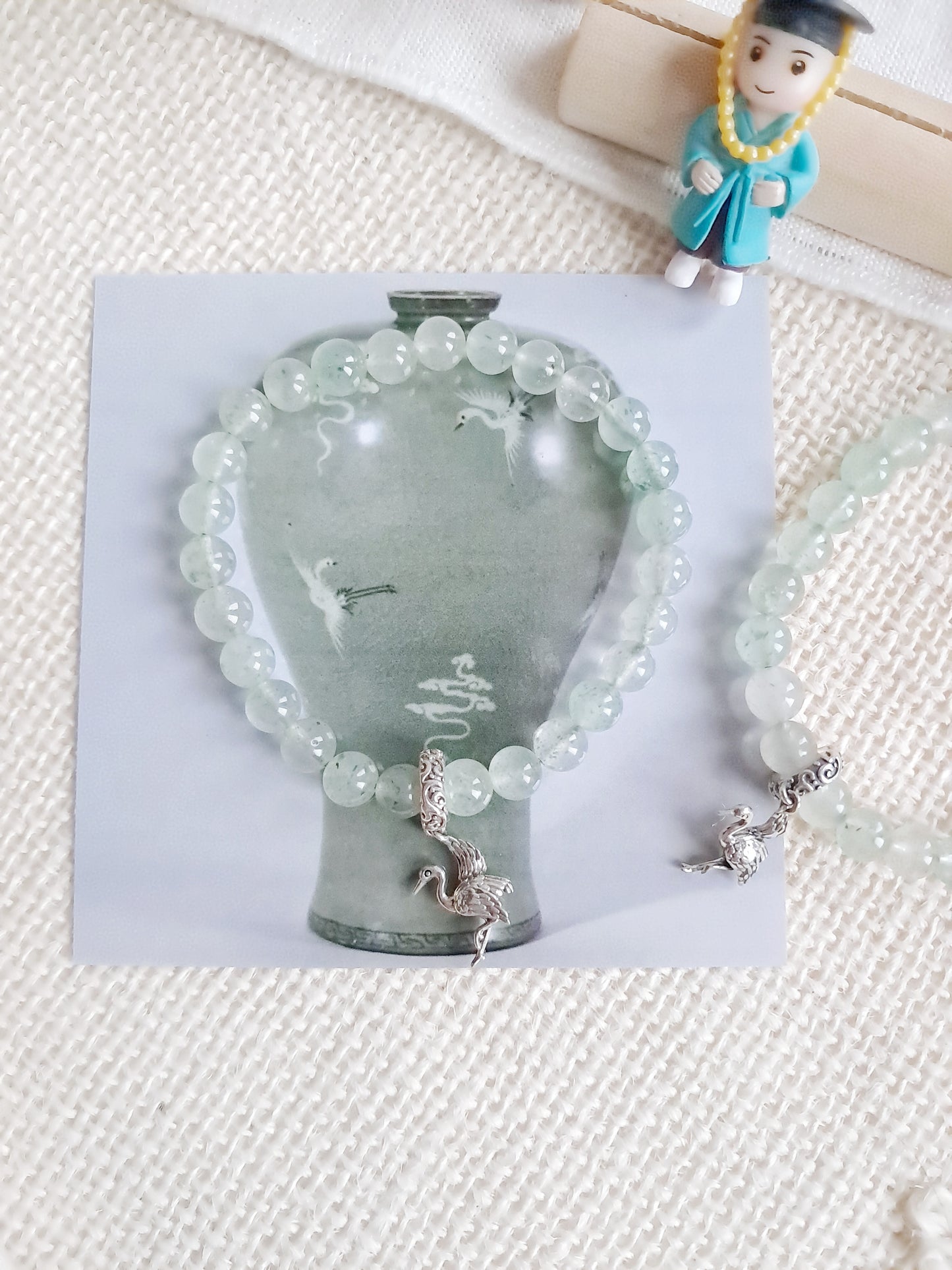 Bracelet celadon Maebyeong  avec sa breloque grue en argent 925