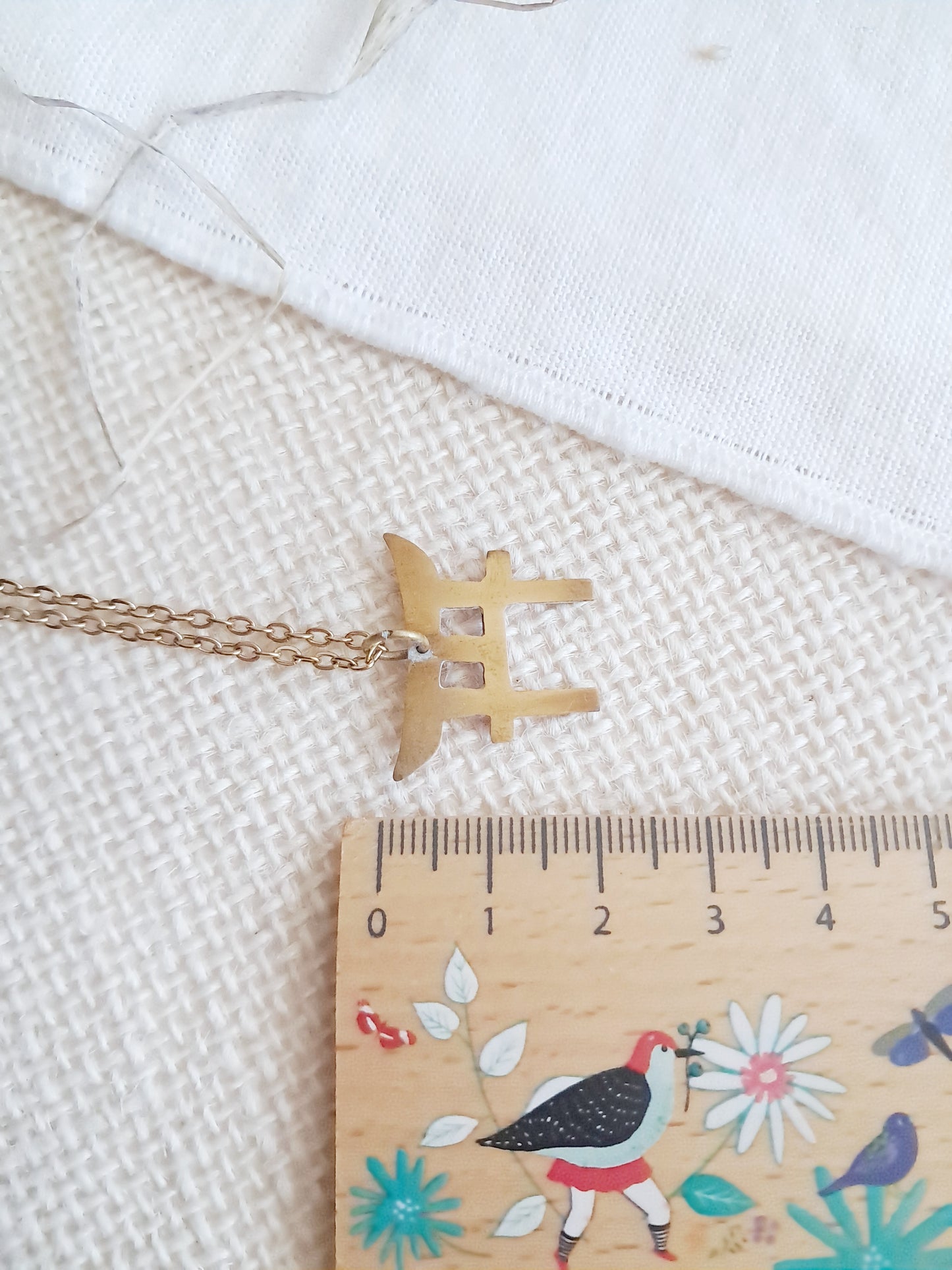 Collier torii en laiton