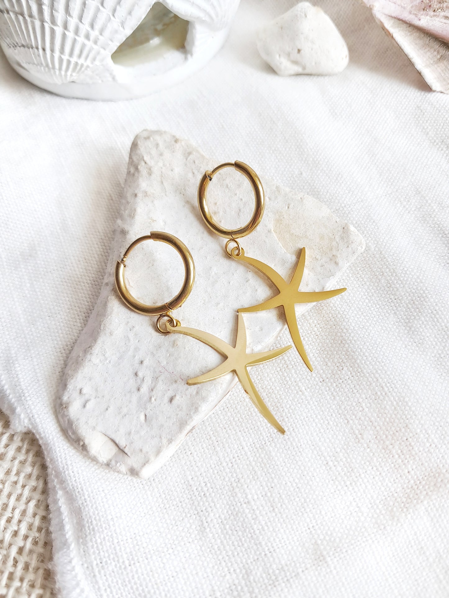 Boucles d'oreilles créoles étoiles de mer en acier inoxydable doré