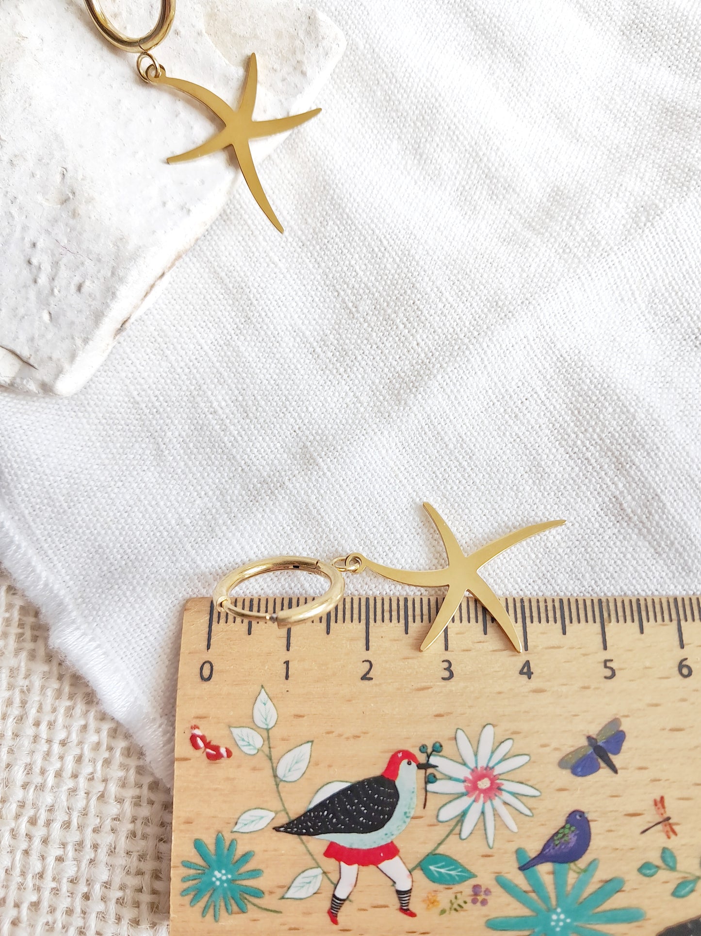 Boucles d'oreilles créoles étoiles de mer en acier inoxydable doré