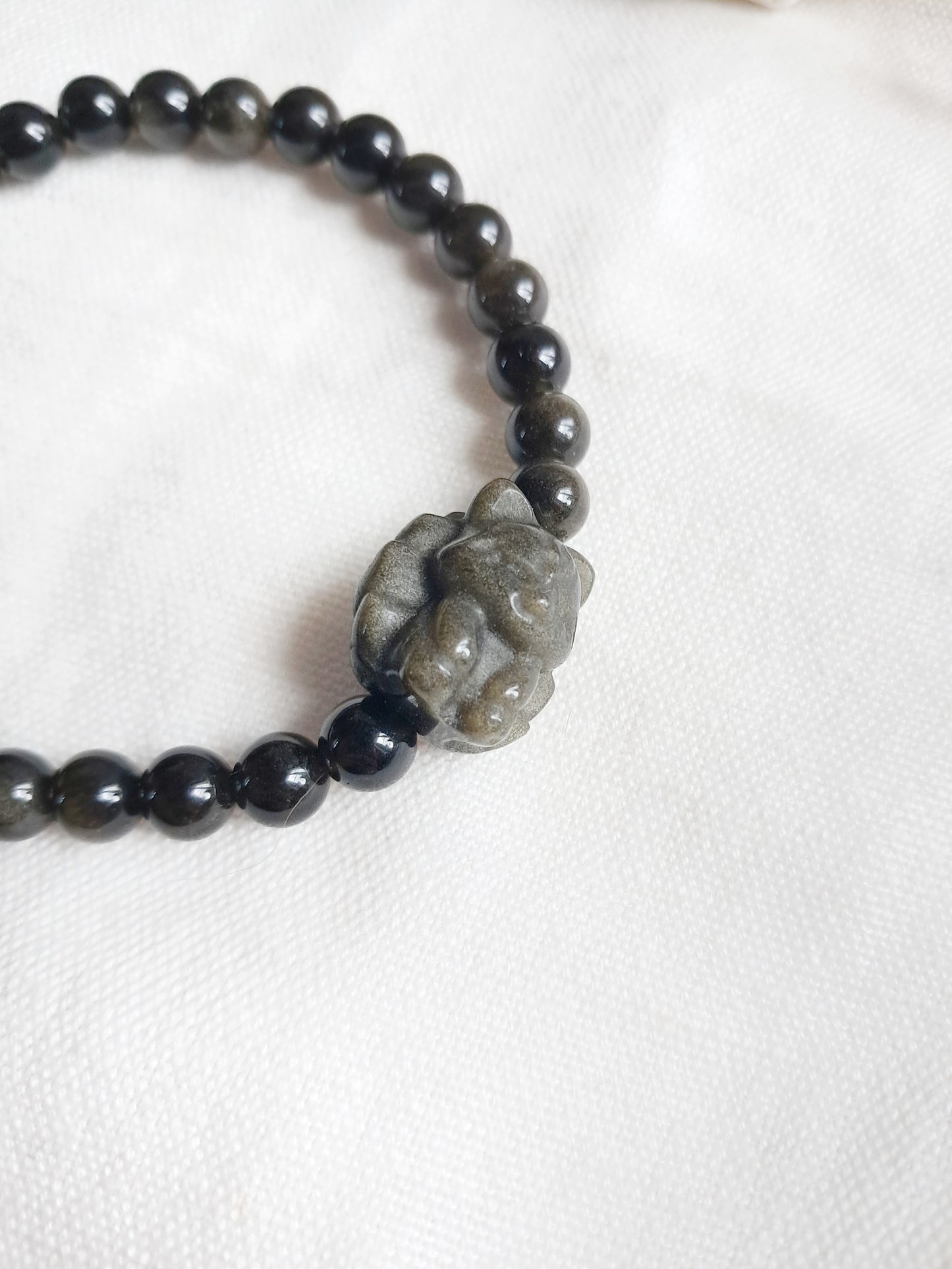 Bracelet renard à neuf queues en obsidienne dorée