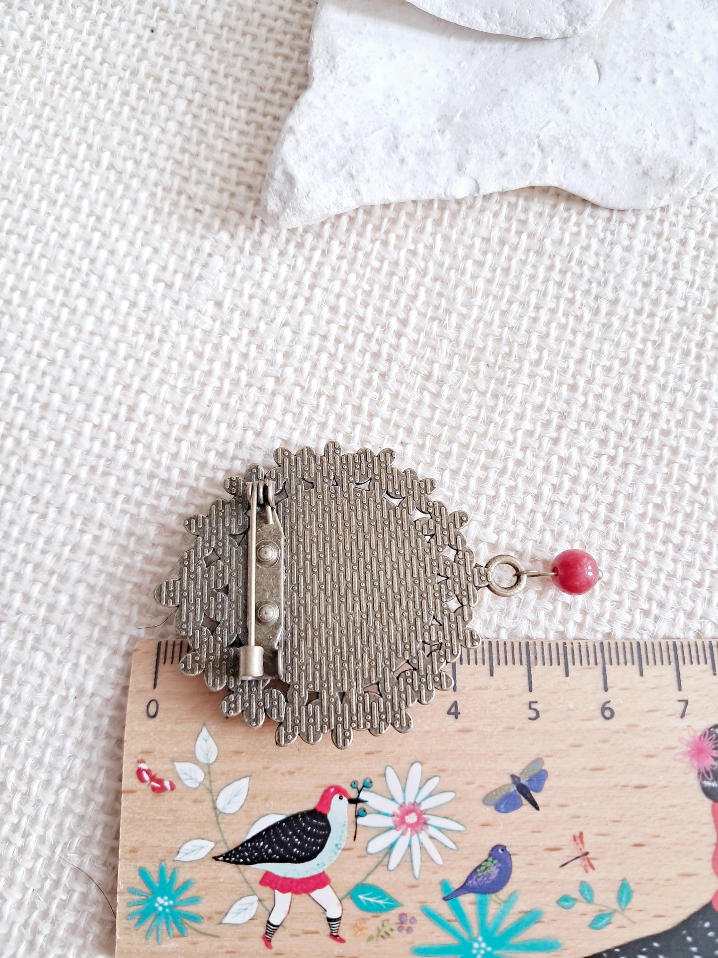 Broche cabochon perroquet