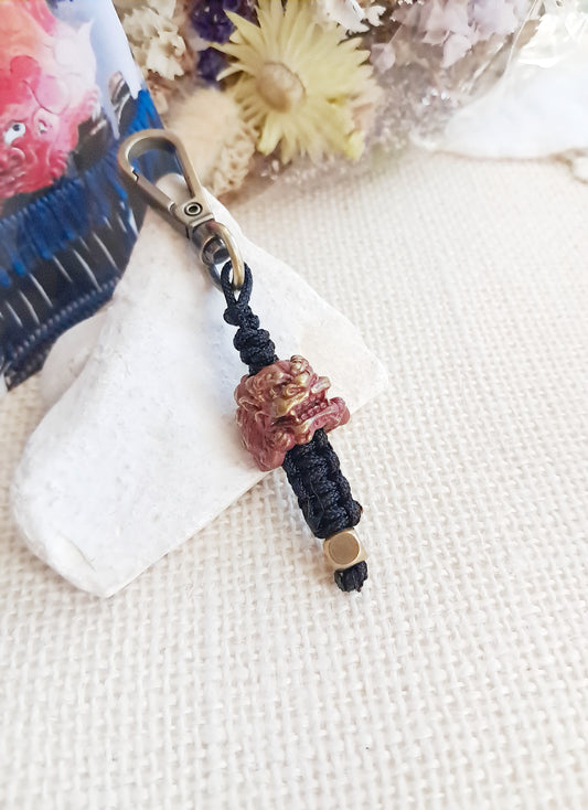 Porte-clés inspiré d'une cuirasse à décor de komainu