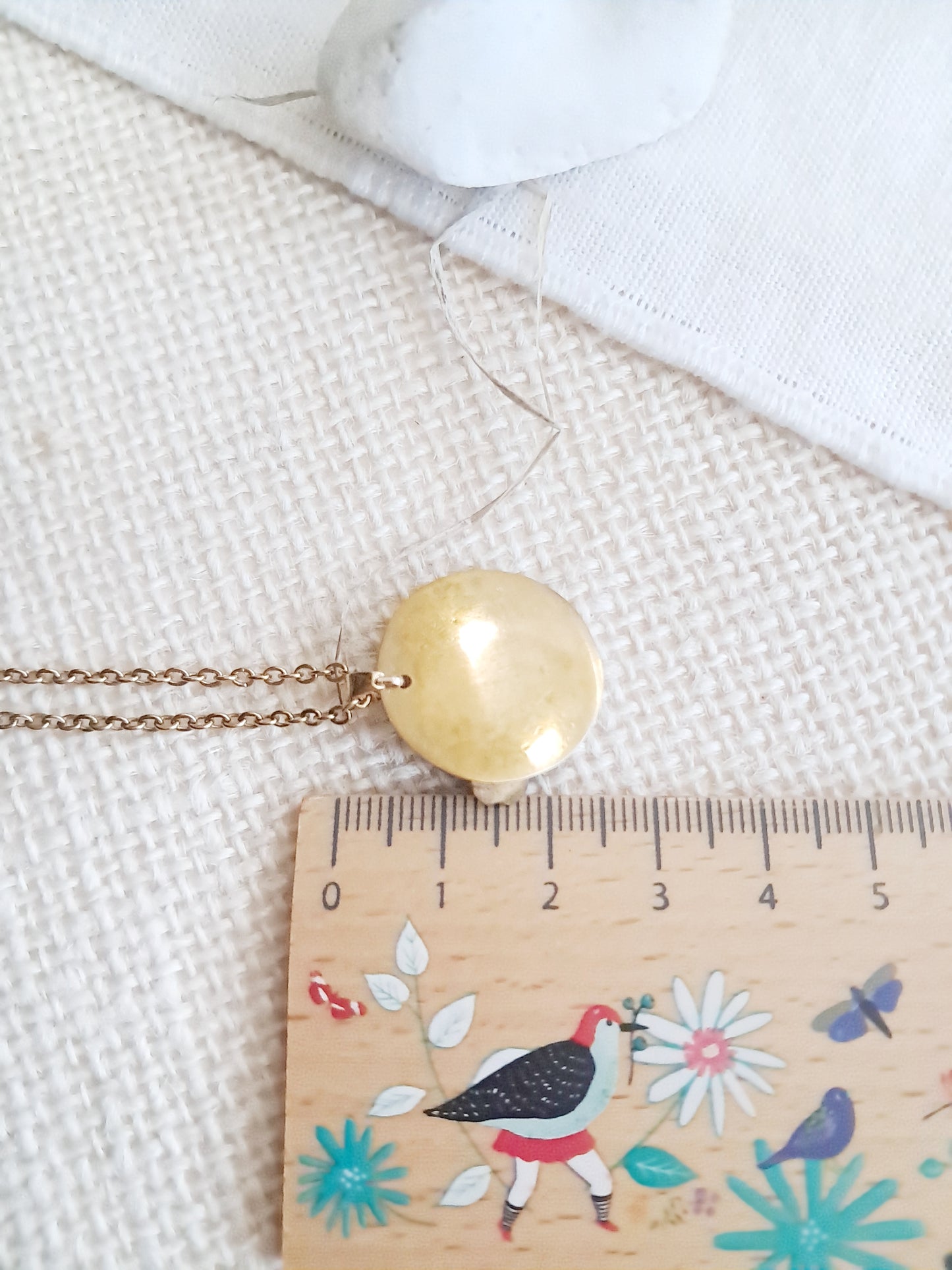 Collier médaillon fleurs de cerisier en laiton