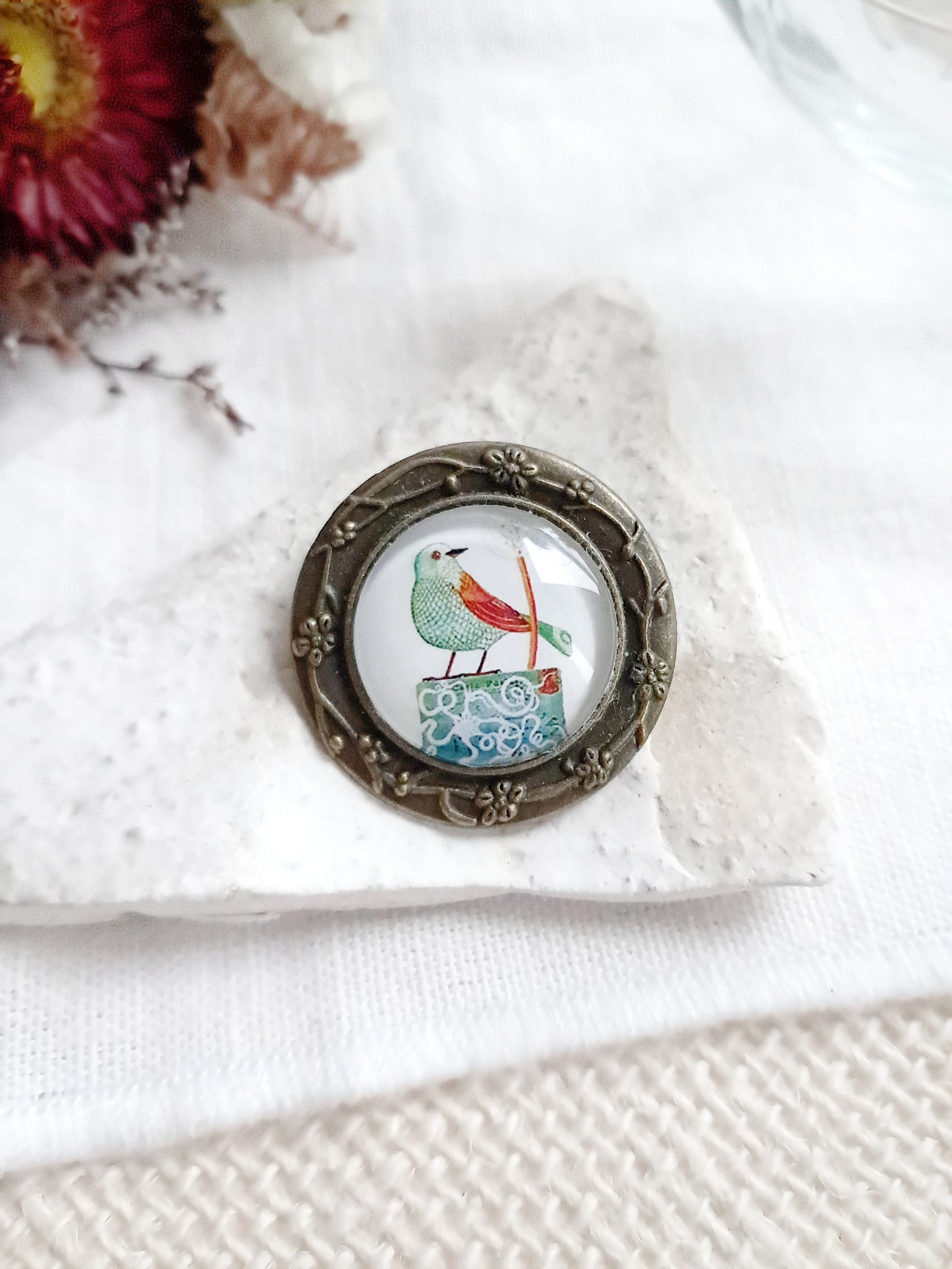 Broche cabochon oiseau