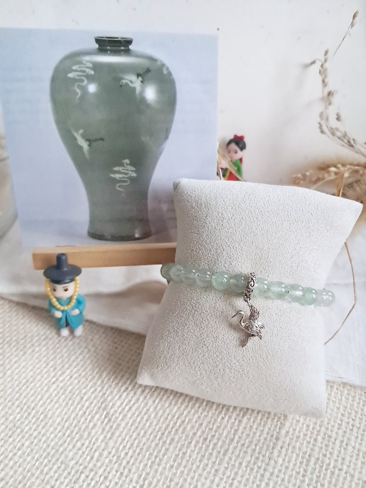 Bracelet celadon Maebyeong  avec sa breloque grue en argent 925