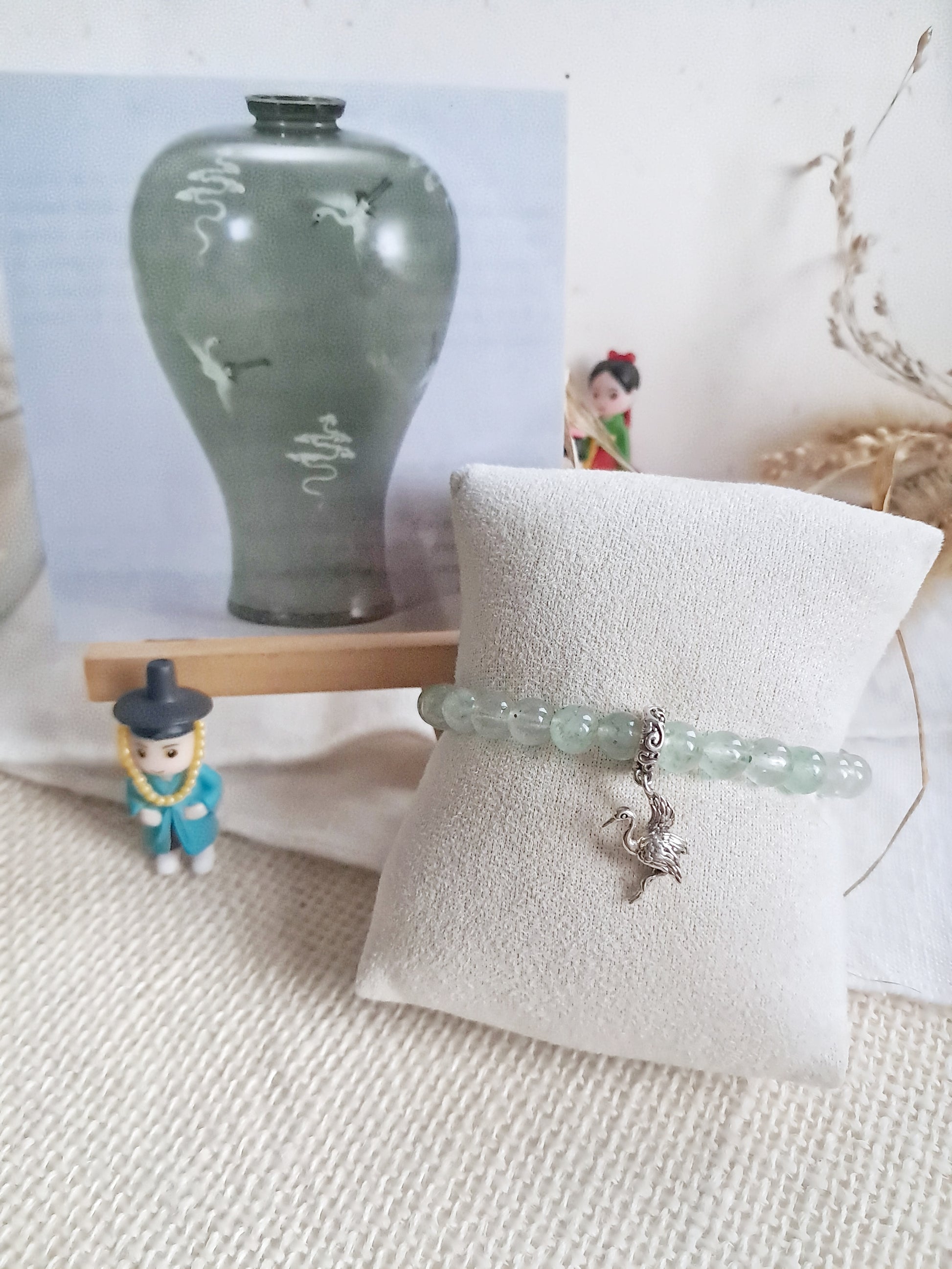 Bracelet celadon Maebyeong  avec sa breloque grue en argent 925