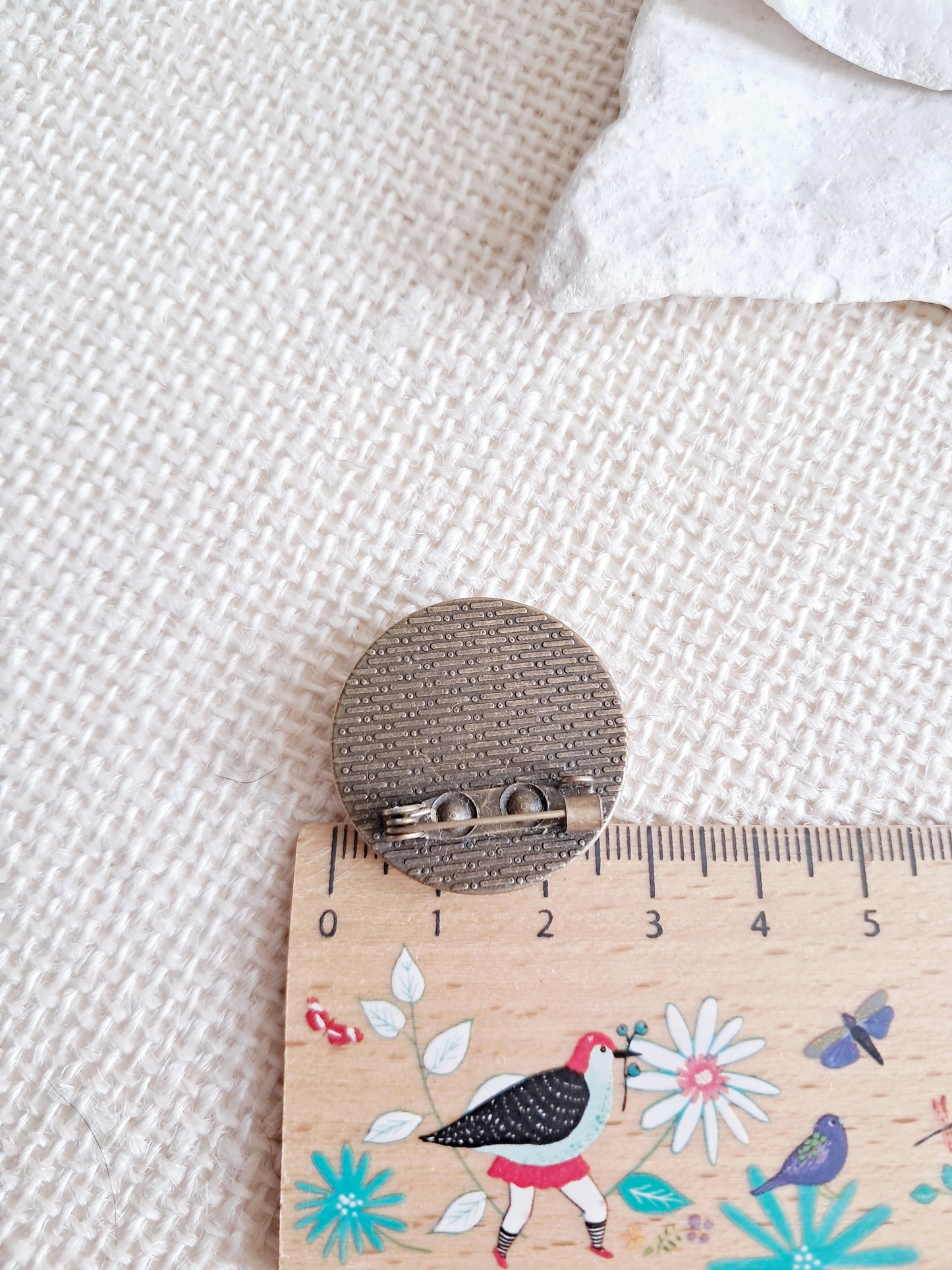 Broche cabochon perroquet